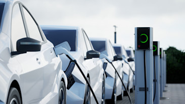 Row of EVs charging. Image credit: 3alexd via istock