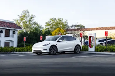 Tesla at Supercharger in Residential Area 