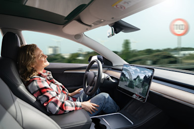 Woman-In-Self-Driving-Car