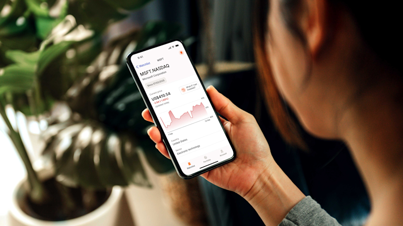 Woman checking her Sharesight account on her mobile phone