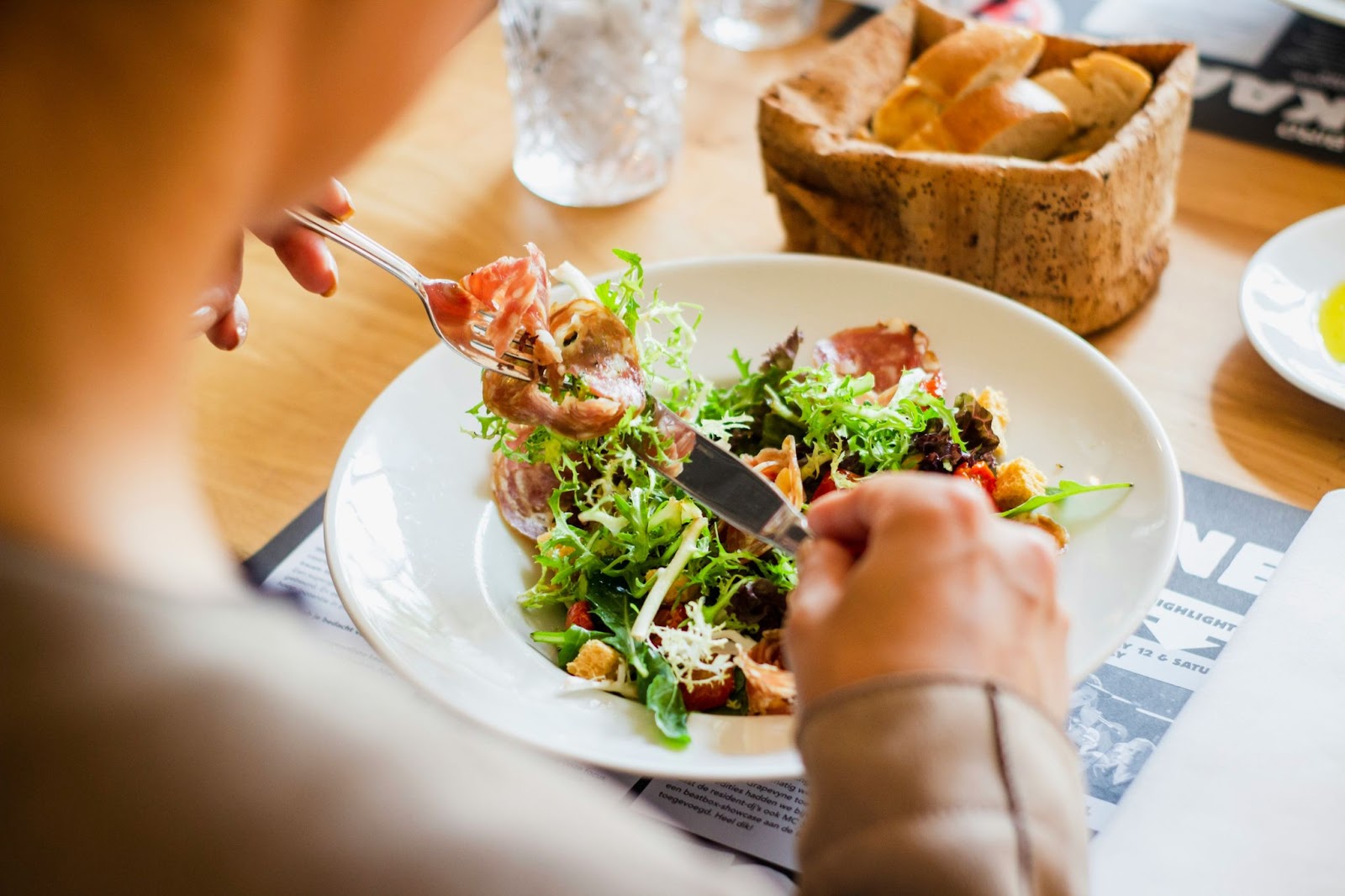 Person eating a salad