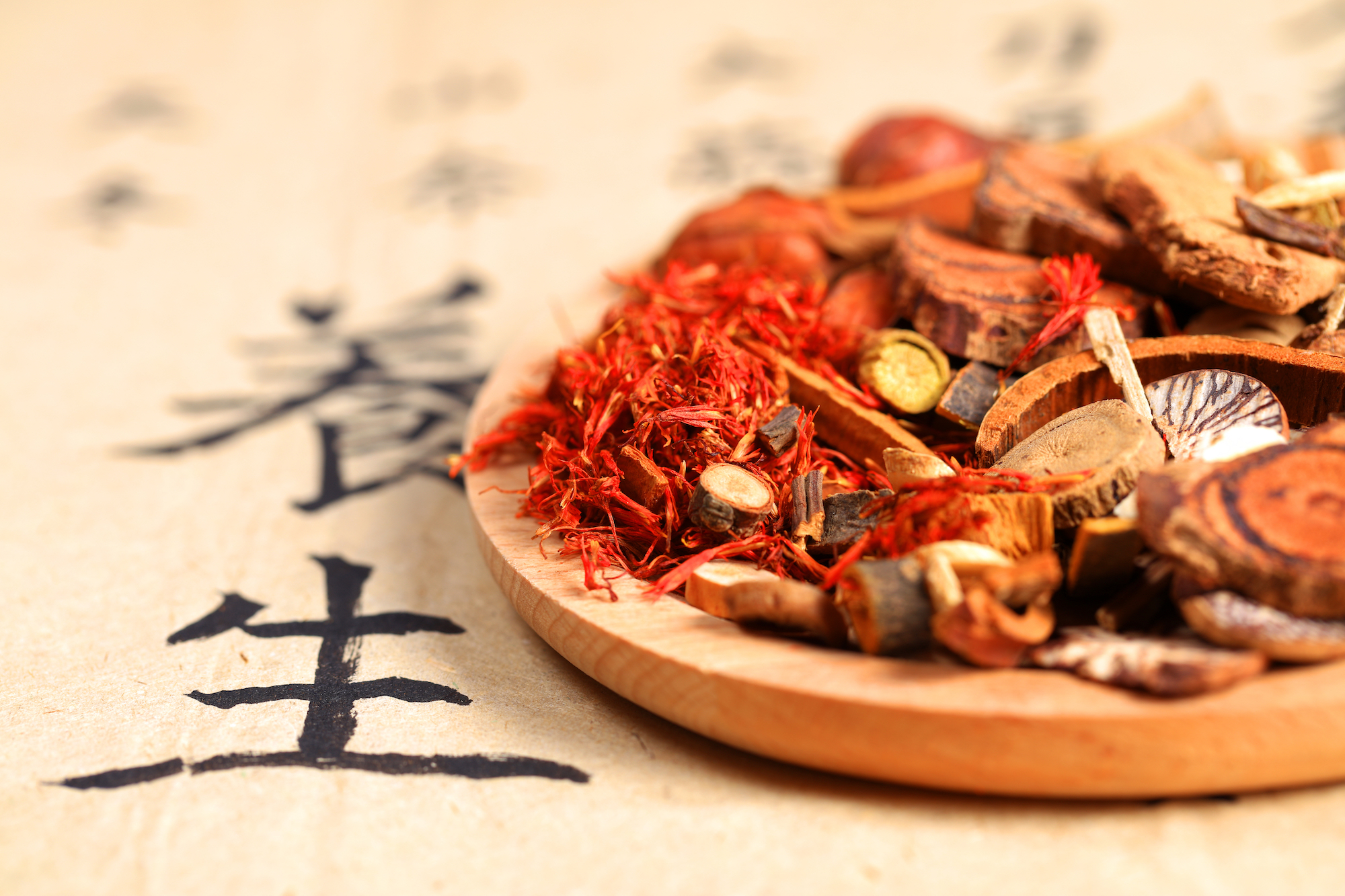 Chinese herbs on a wood plate