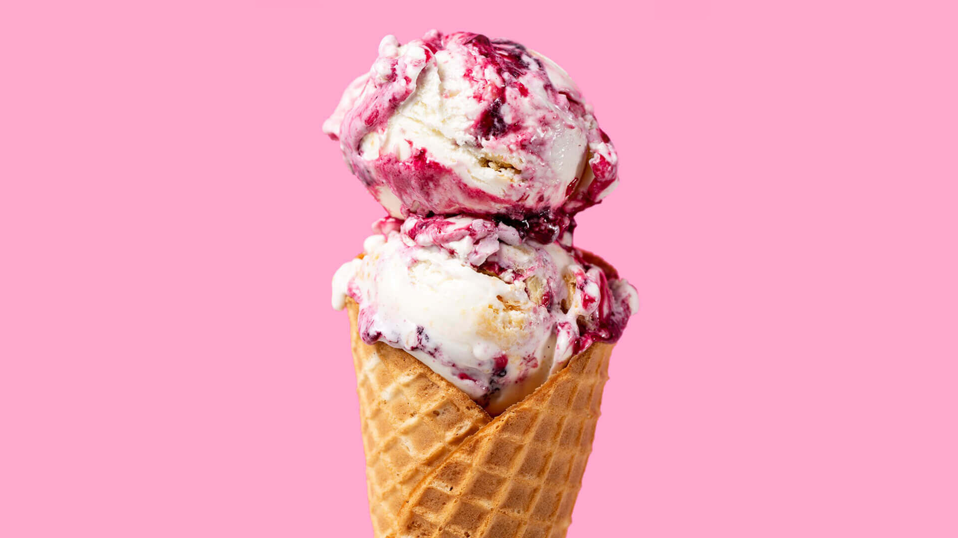 Ice cream cone against pink background