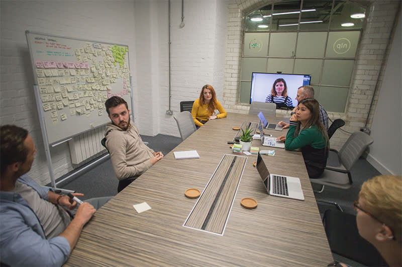 Discovery image of a meeting in a room
