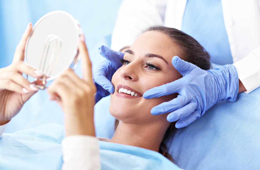 Smiling patient with the dentists