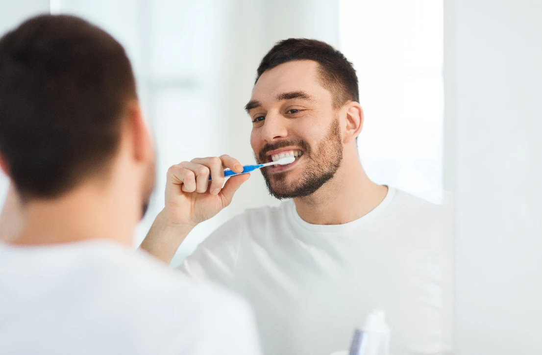 Man or Woman brushing teeth