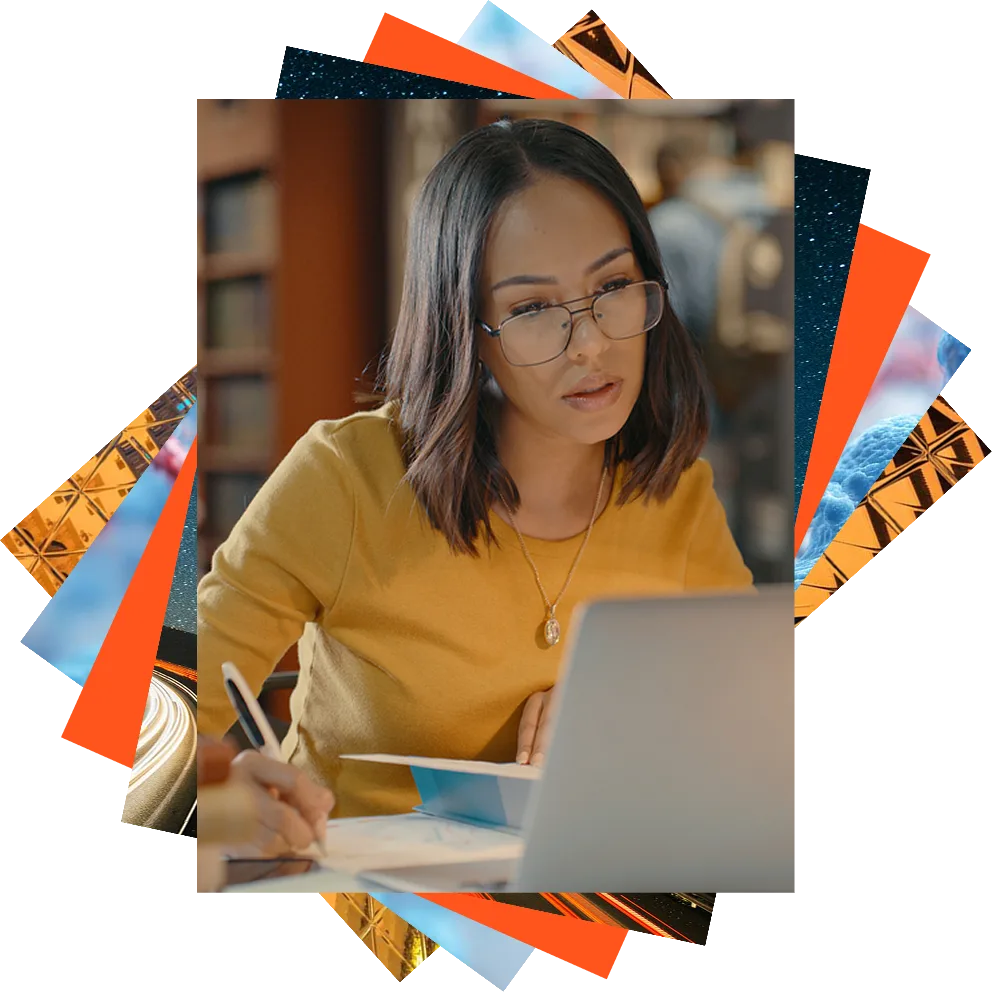 Woman looking at computer, reflection in her glasses