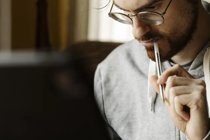 Man-on-computer-research-author