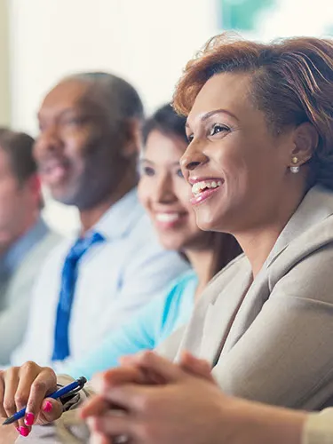 Smiling professionals in meeting