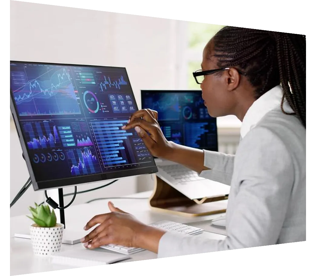 Advisor looking at financial analytics graphs on computer screen