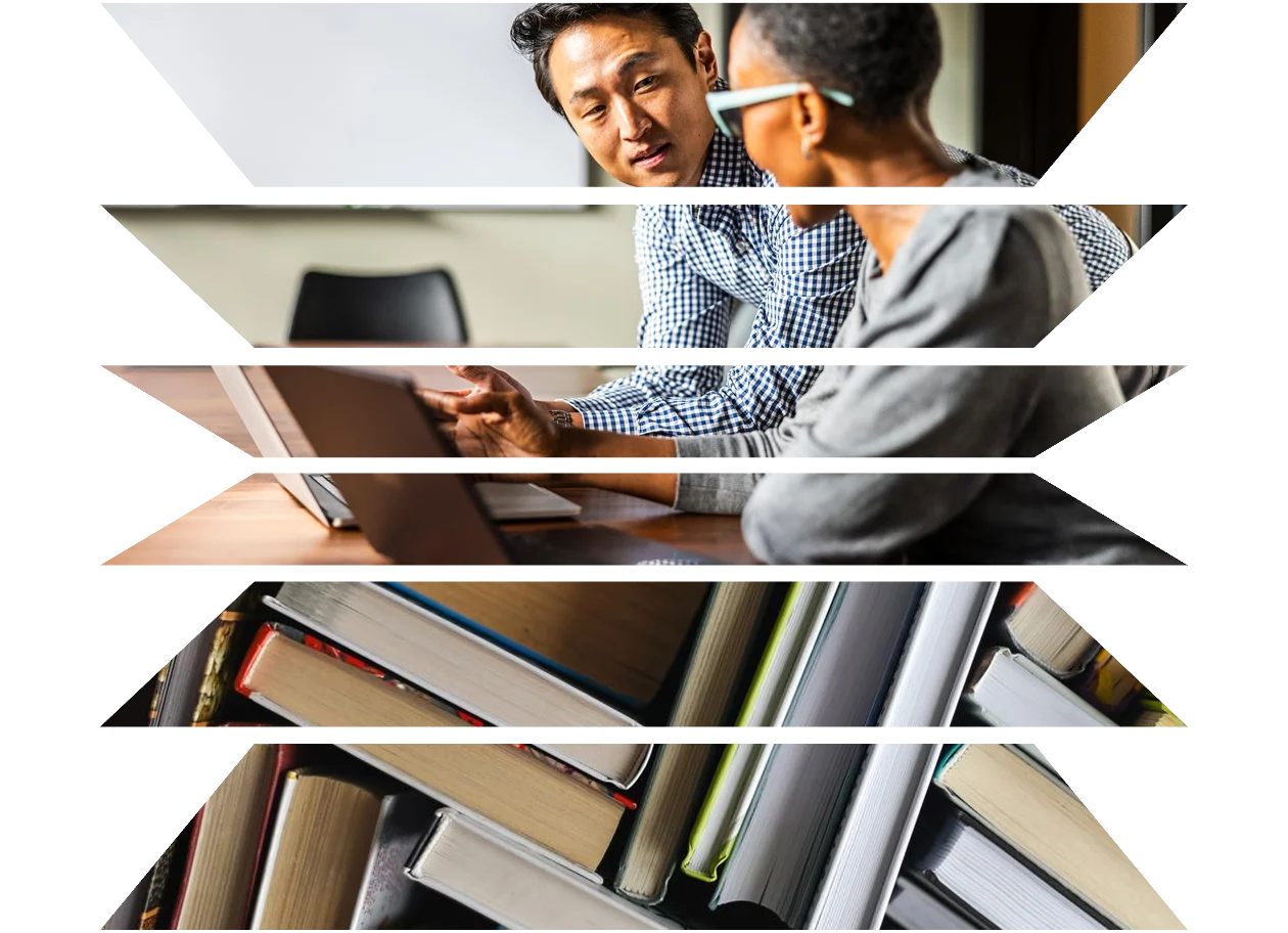 Business colleagues working on laptops in modern conference room