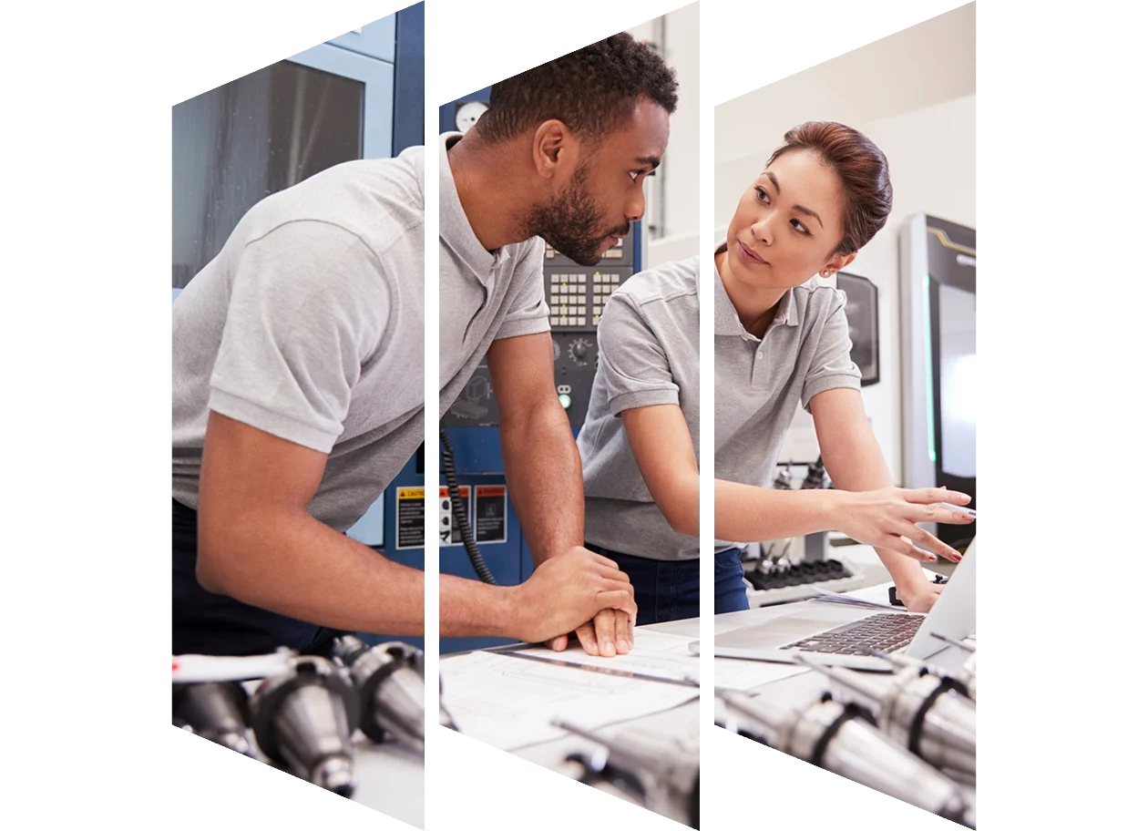 Two students in conversation with chalkboard in background
