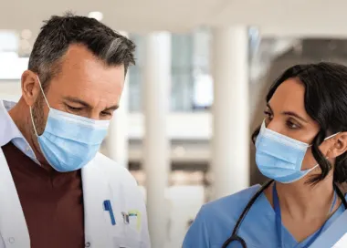 Doctor speaking with nurse