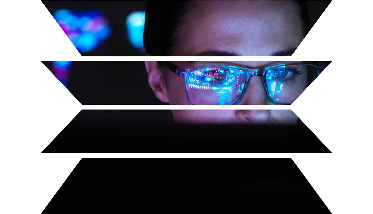 Engineer designing AI technology with reflection on eyeglasses