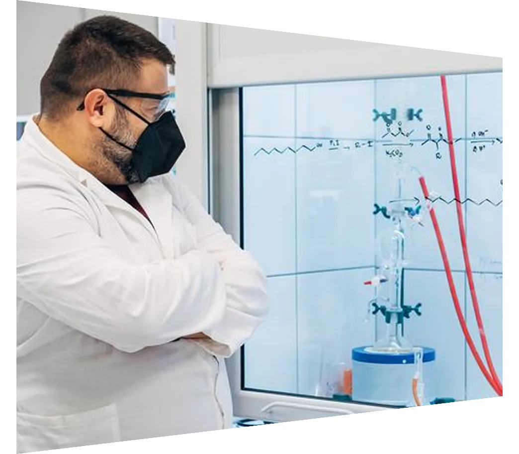 Male scientist wearing face mask doing research on vaccine