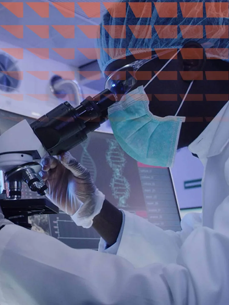 Microbiologist studying a virus with a microscope