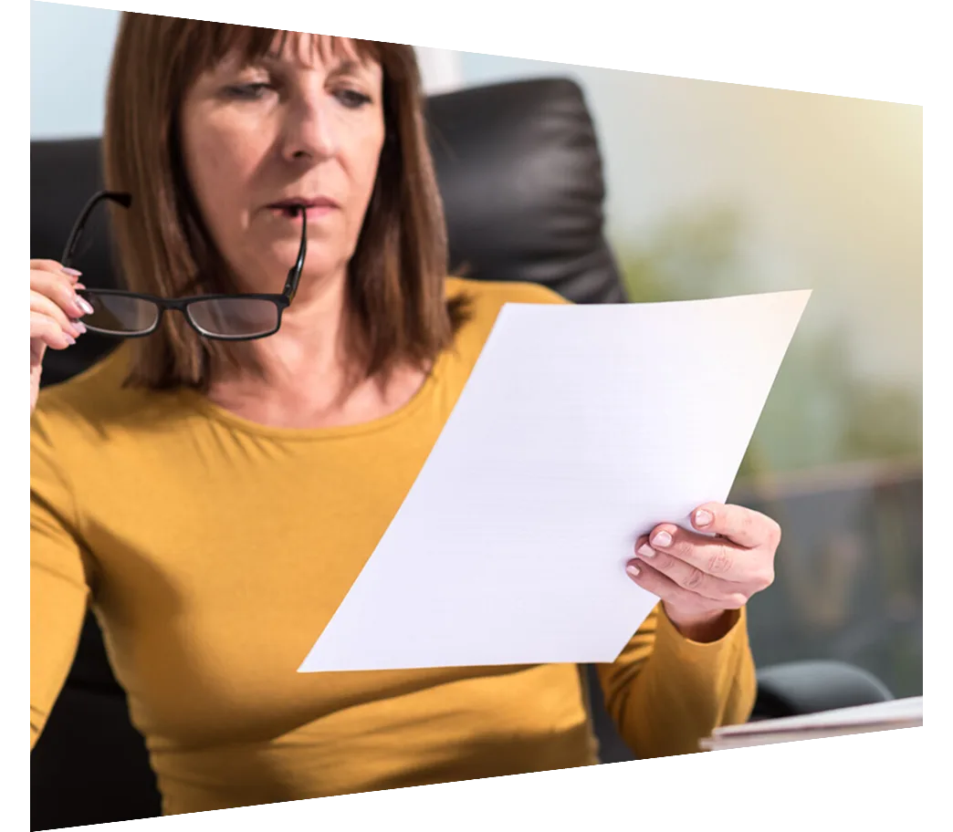 Mature woman reviewing report