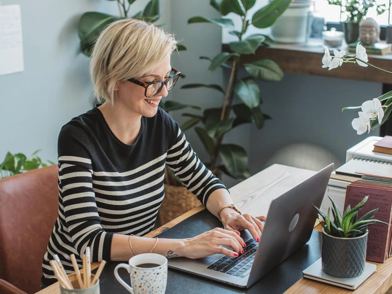Researcher working on laptop at her desk