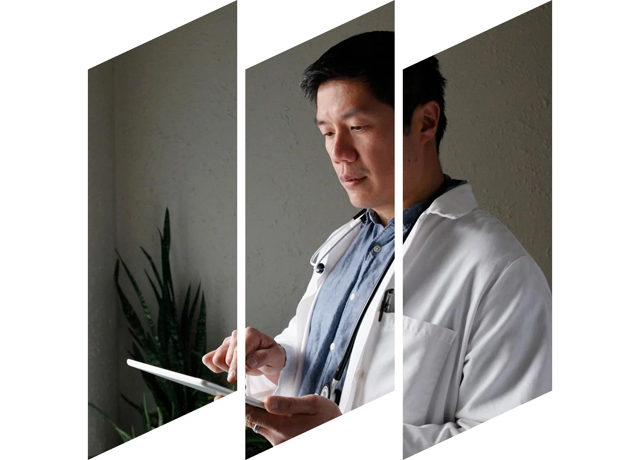 Young male physician wearing glasses, side profile