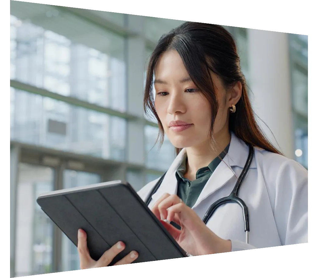 Female doctor looking at ipad