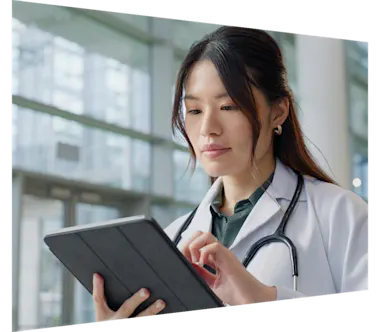 Female doctor looking at ipad