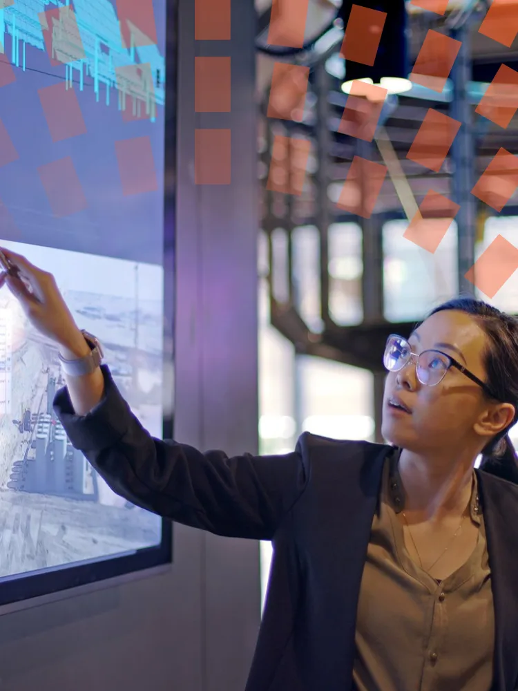 Colleague reviewing data on screen