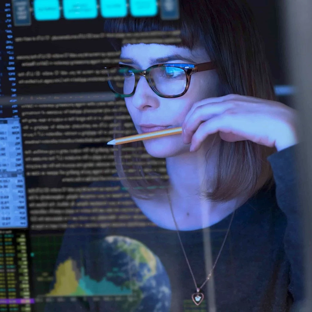 A woman looking at a screen