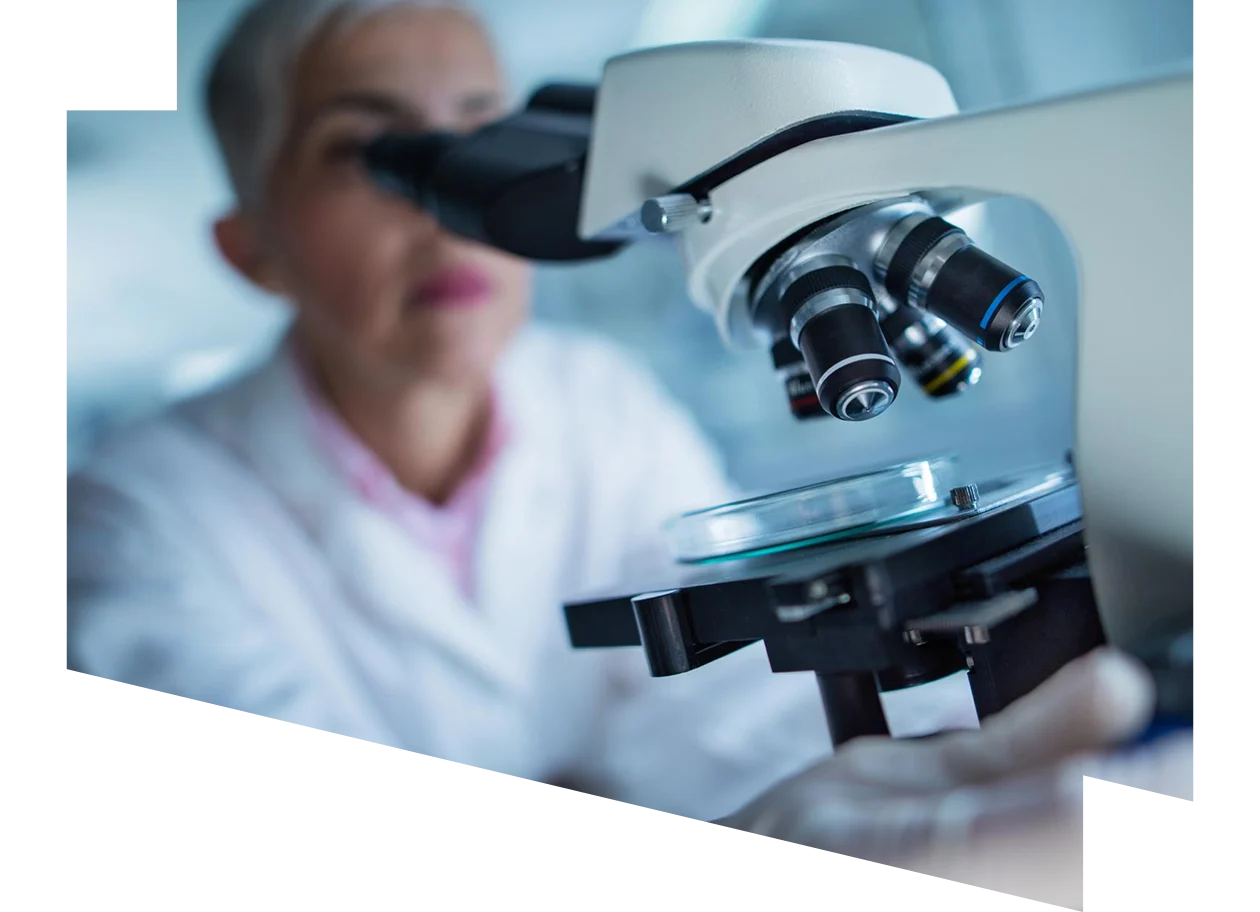 Close up of a scientist using a microscope in a laboratory