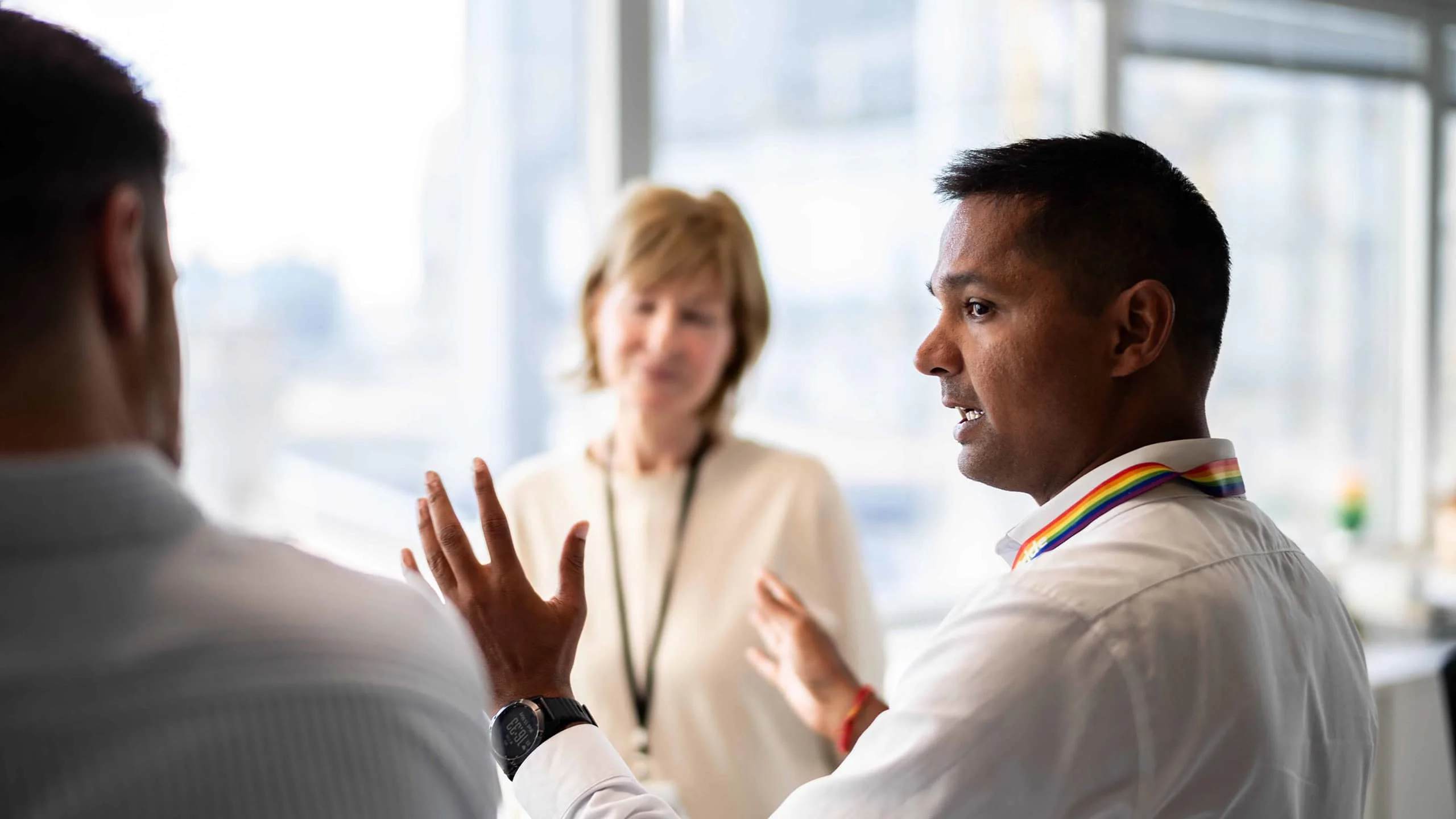 Sales, Marketing and Customers Success Team engaged in discussion in office