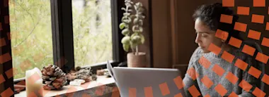 Young author working at home on laptop