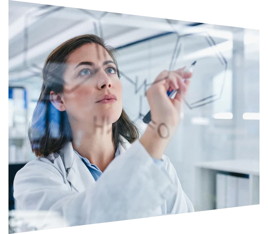 Shot of a scientist solving equations on a glass screen in a laboratory