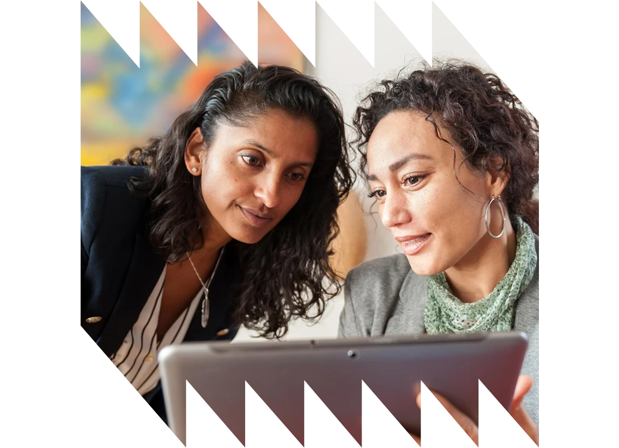 Two business women with tablet computer