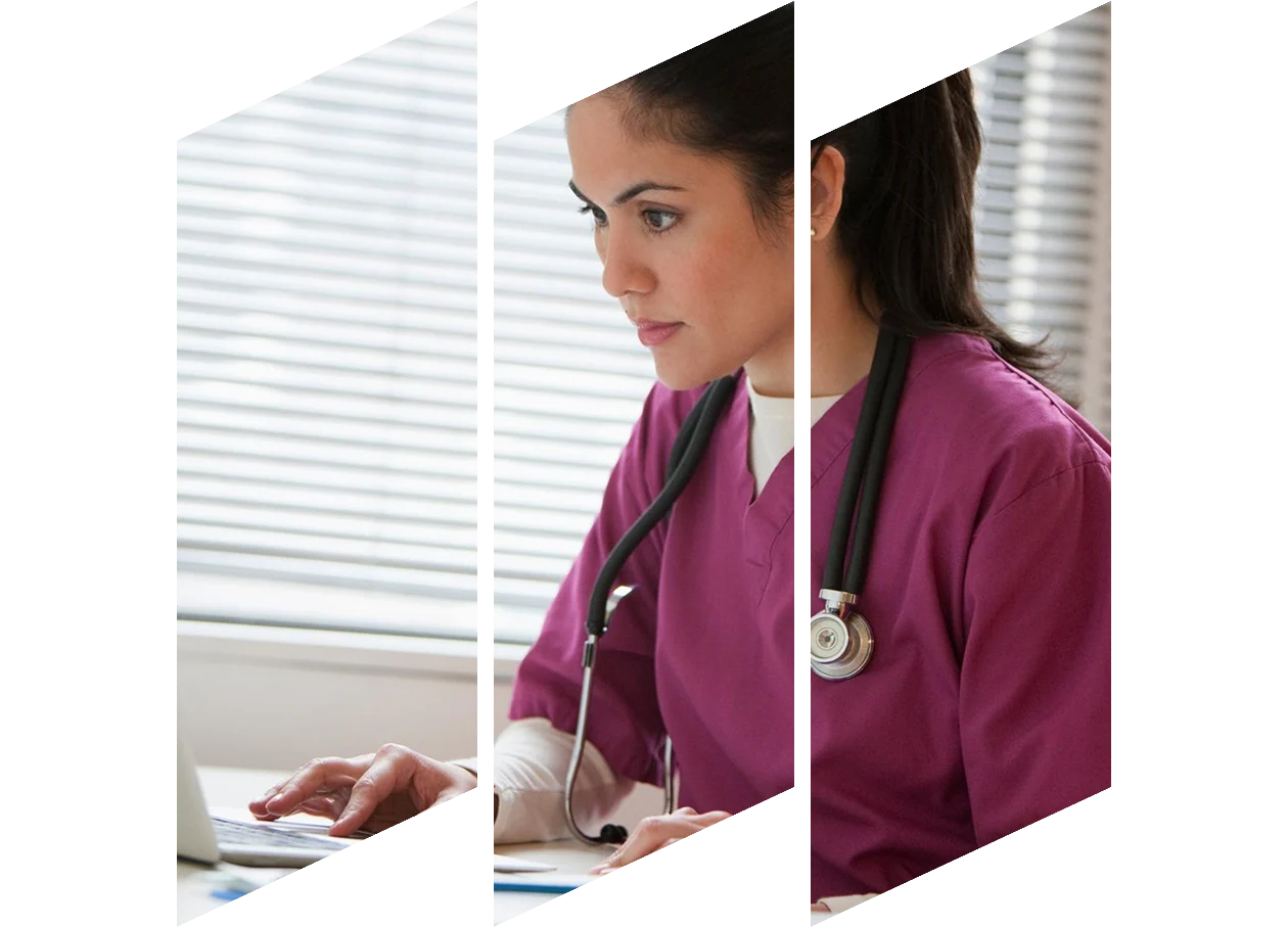 Mixed race nurse using laptop