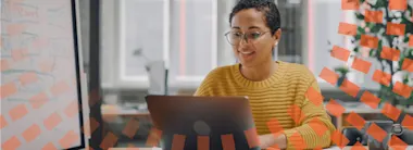 Female reviewer working on her laptop