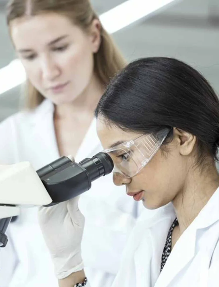 female scientists examining sample