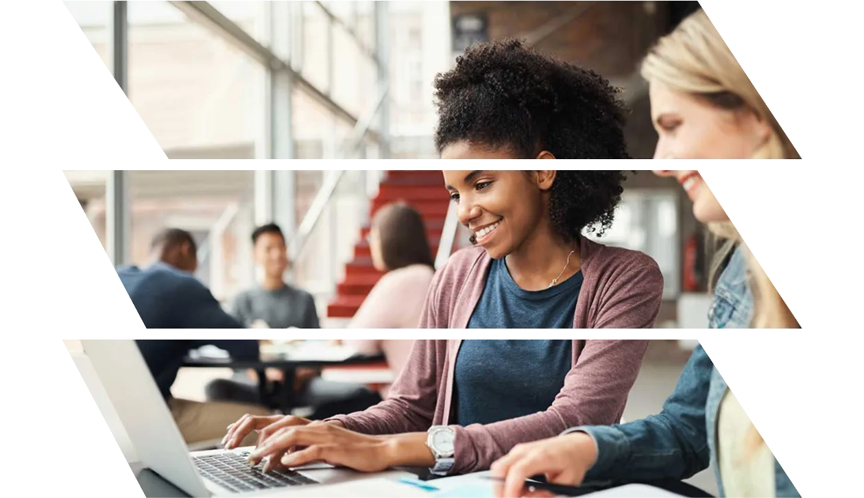 Two female students working together on a laptop