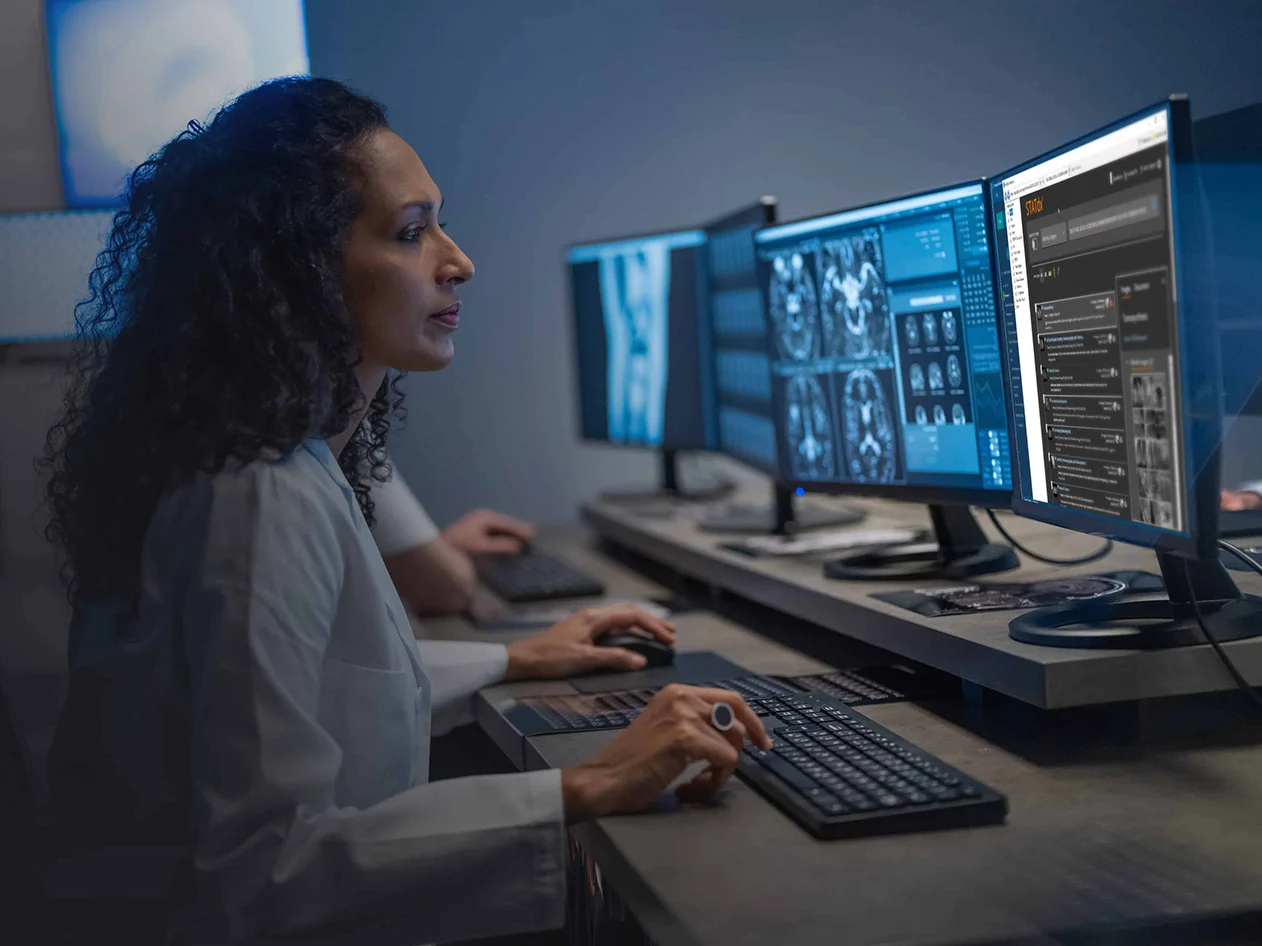 Radiologist reviewing scans using STATdx
