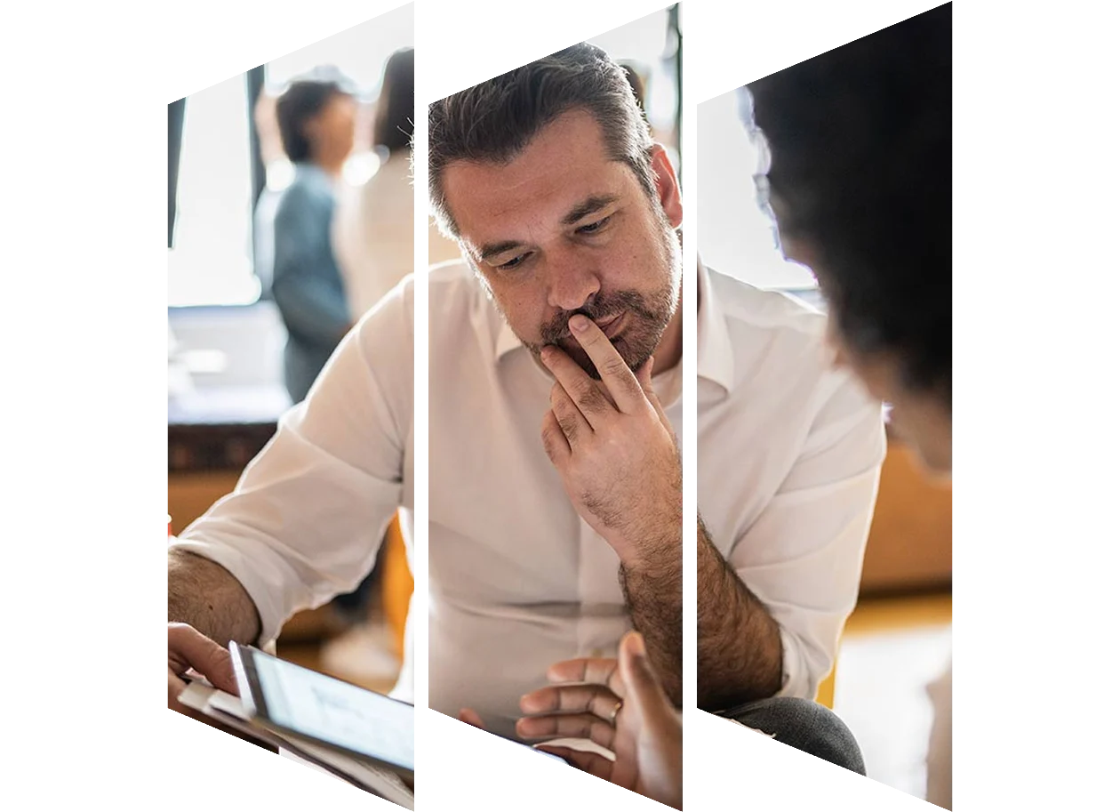 Thoughtful man looking at laptop