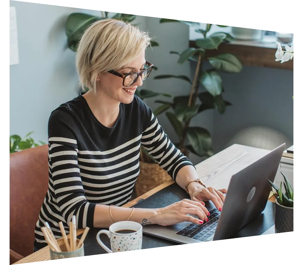 Researcher working on laptop at her desk