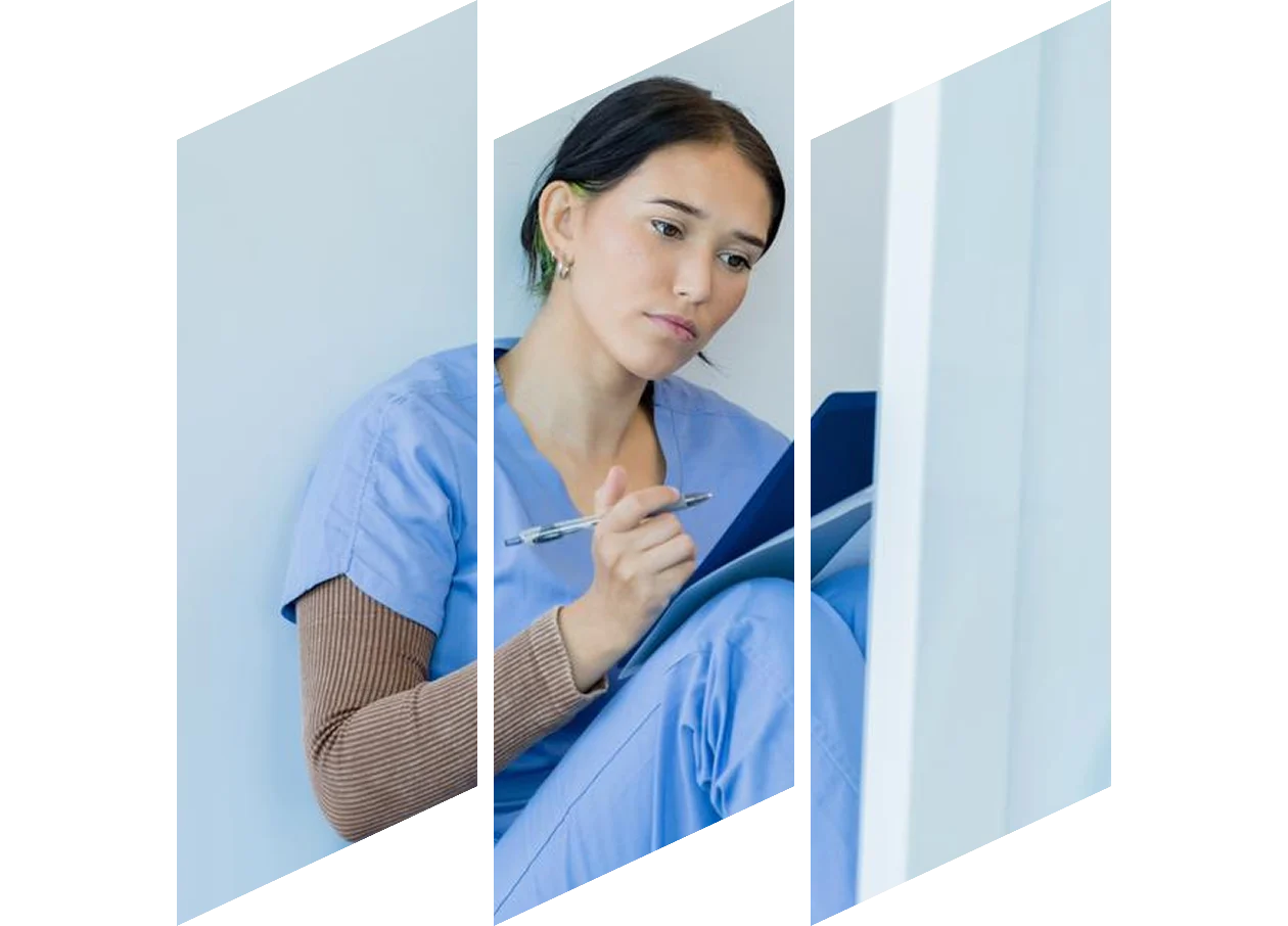 Young female studying on laptop taking notes