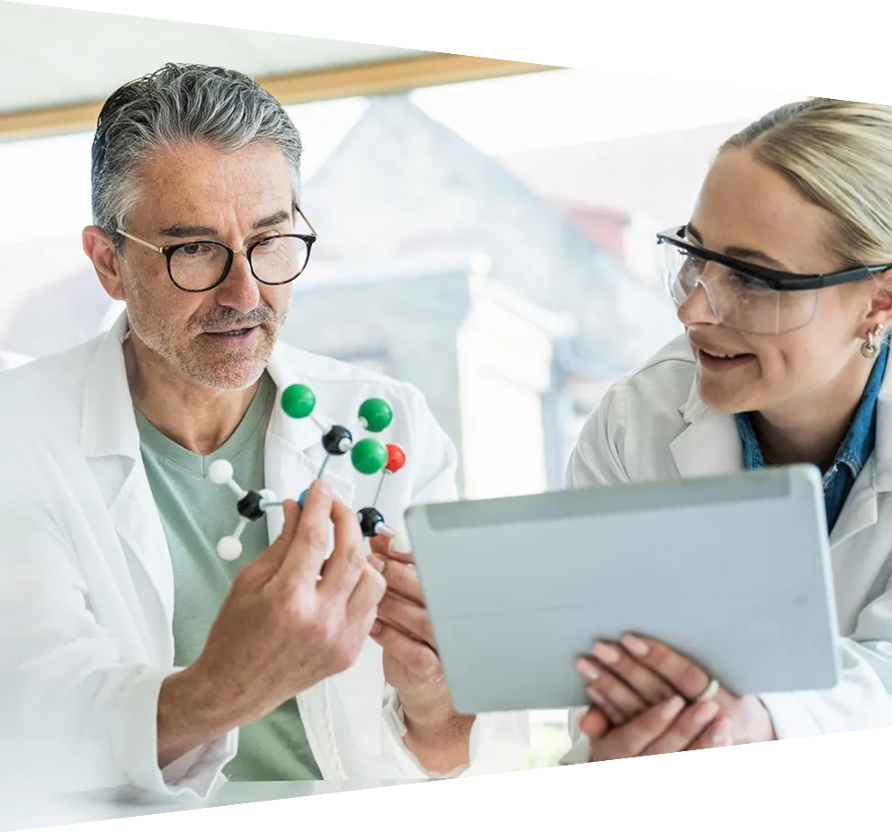 Scientists researching on molecular structure with tablet PC in laboratory