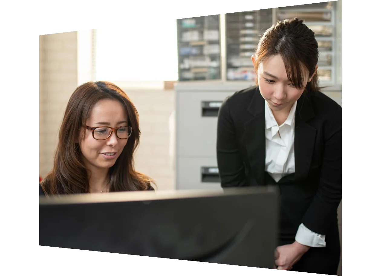 Software developers at the office focusing on the computer