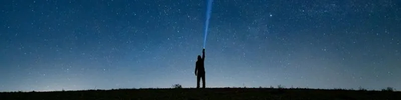 Human figure pointing at the starry sky