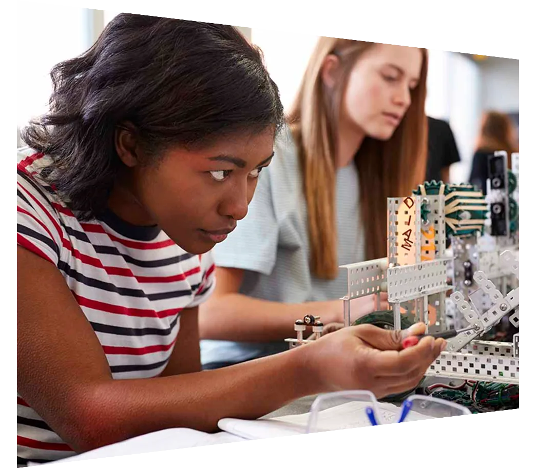 Engineering students in a classroom working on a project