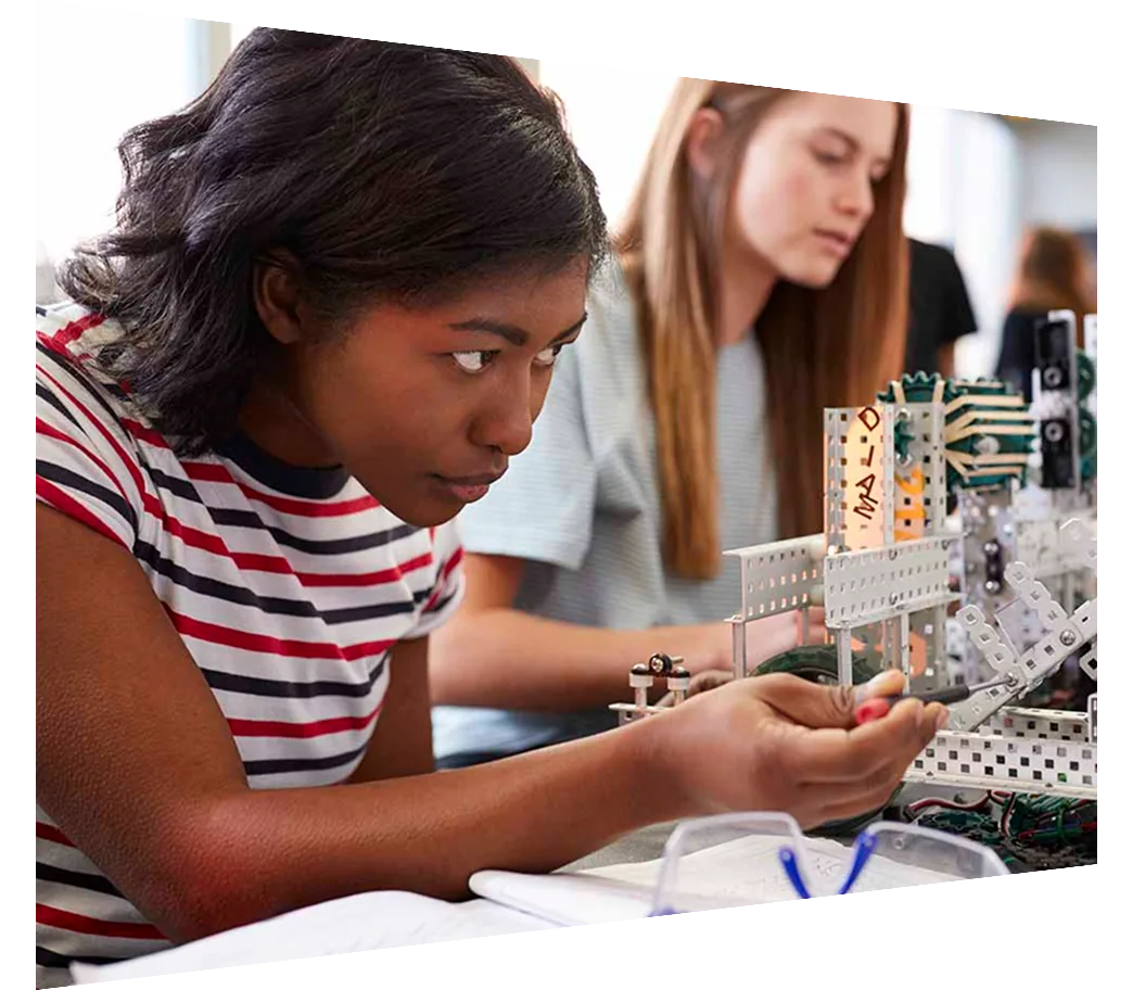 Engineering students in a classroom working on a project