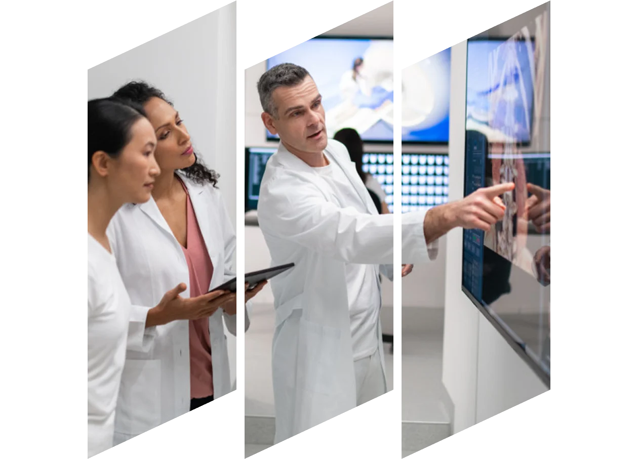 Group of radiologists looking at large screen