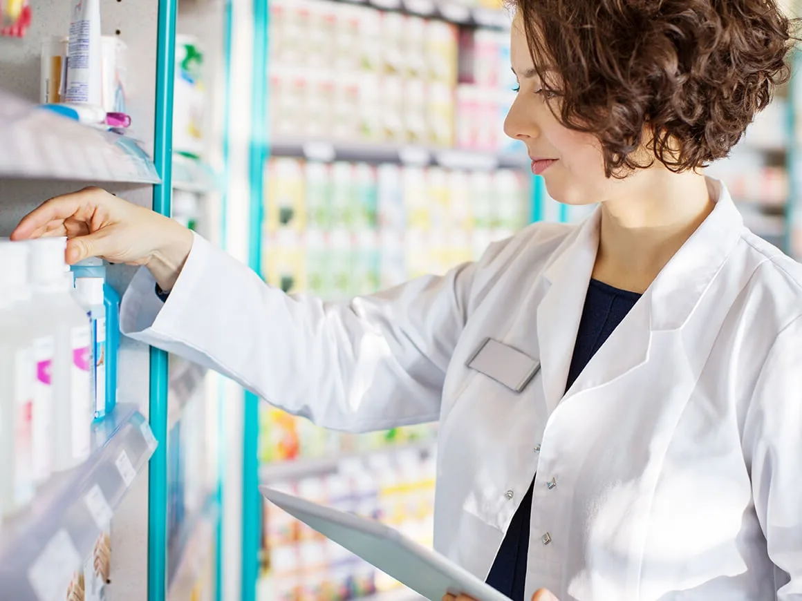 female pharmacist sorting drugs