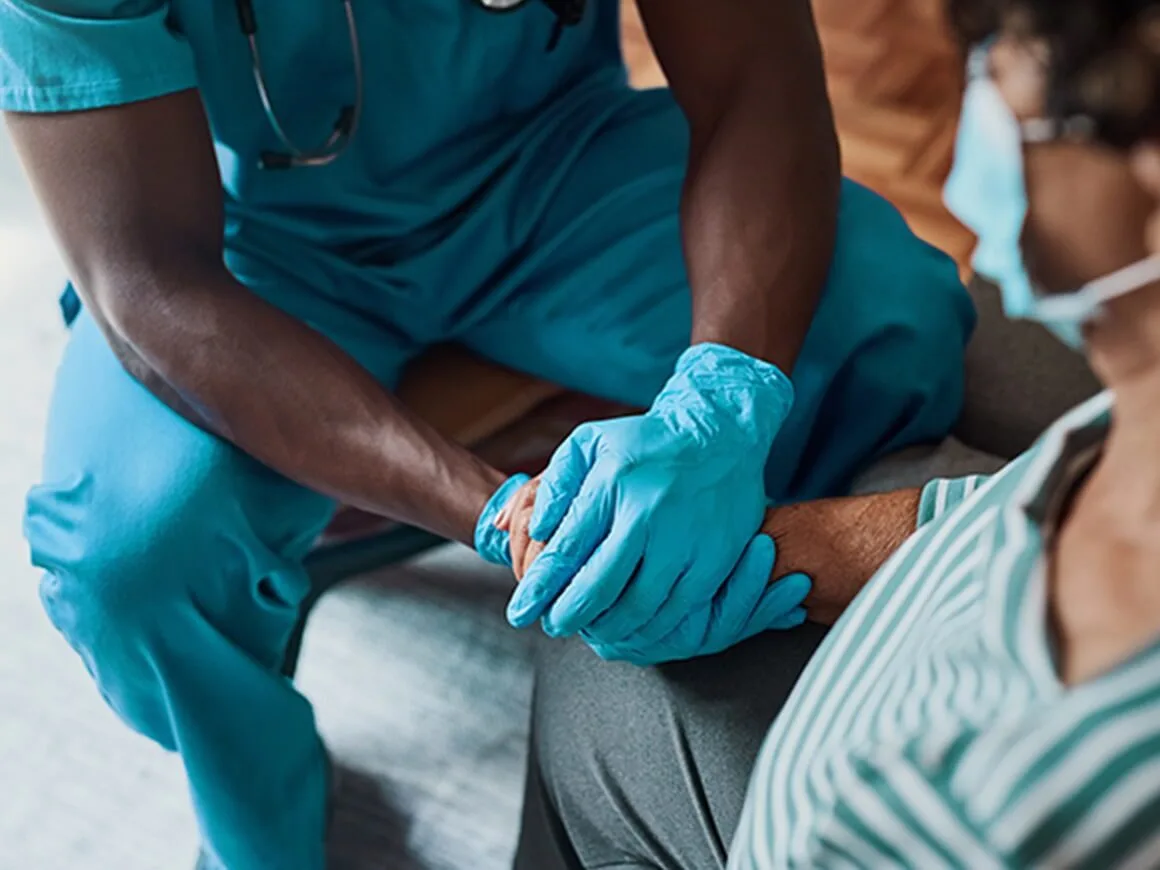 nurse holding a patient hands