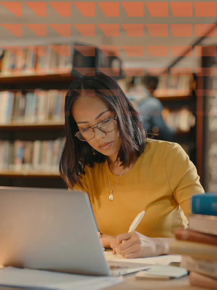 Young lady using a laptop to do research on the internet