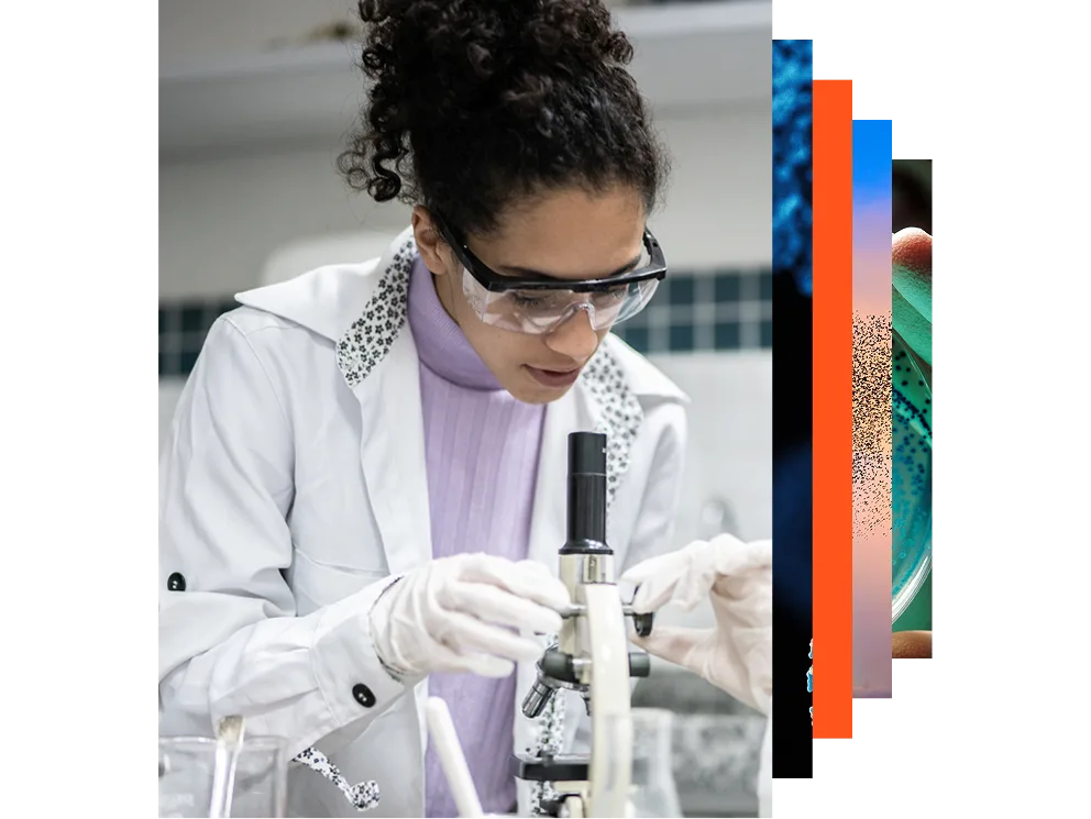 Young scientist looking through a microscope